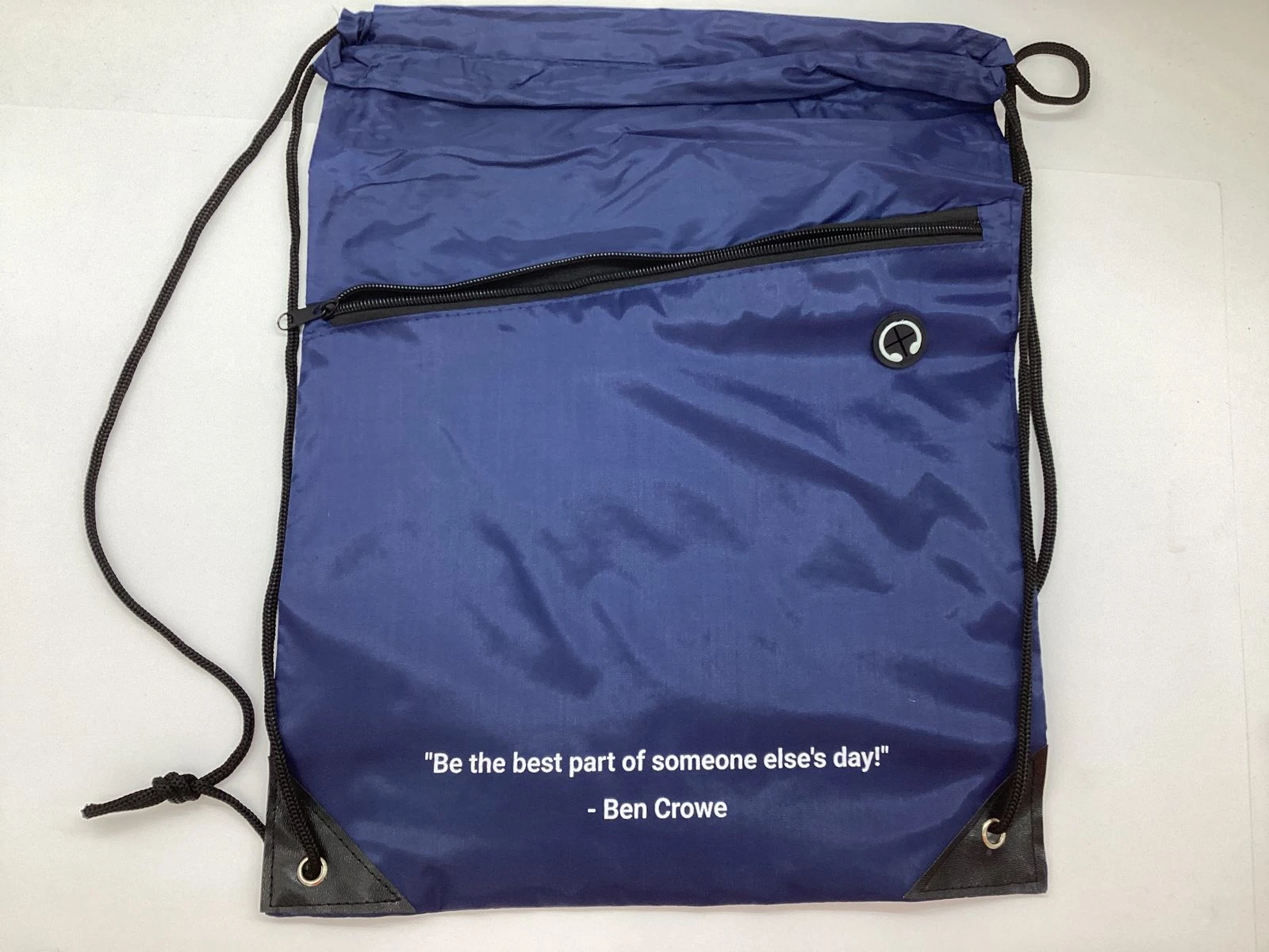 navy blue drawstring bag printed with a quote