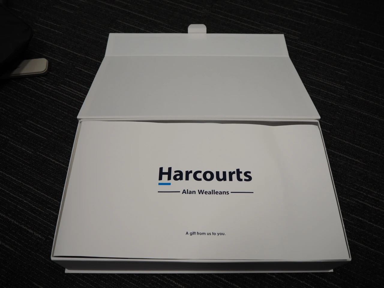 gift box with harcourts logo