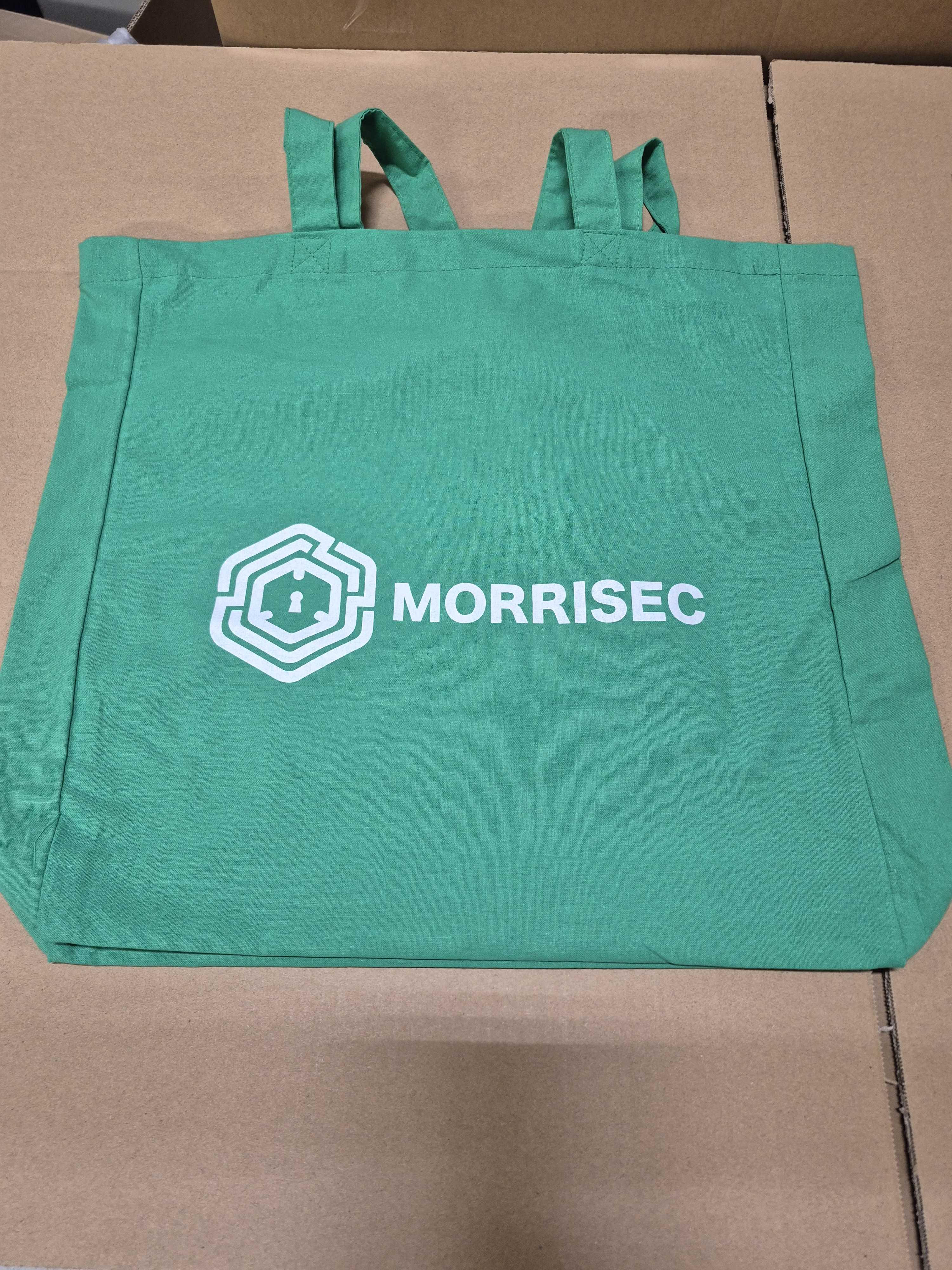 green tote bag branded with Morrisec logo