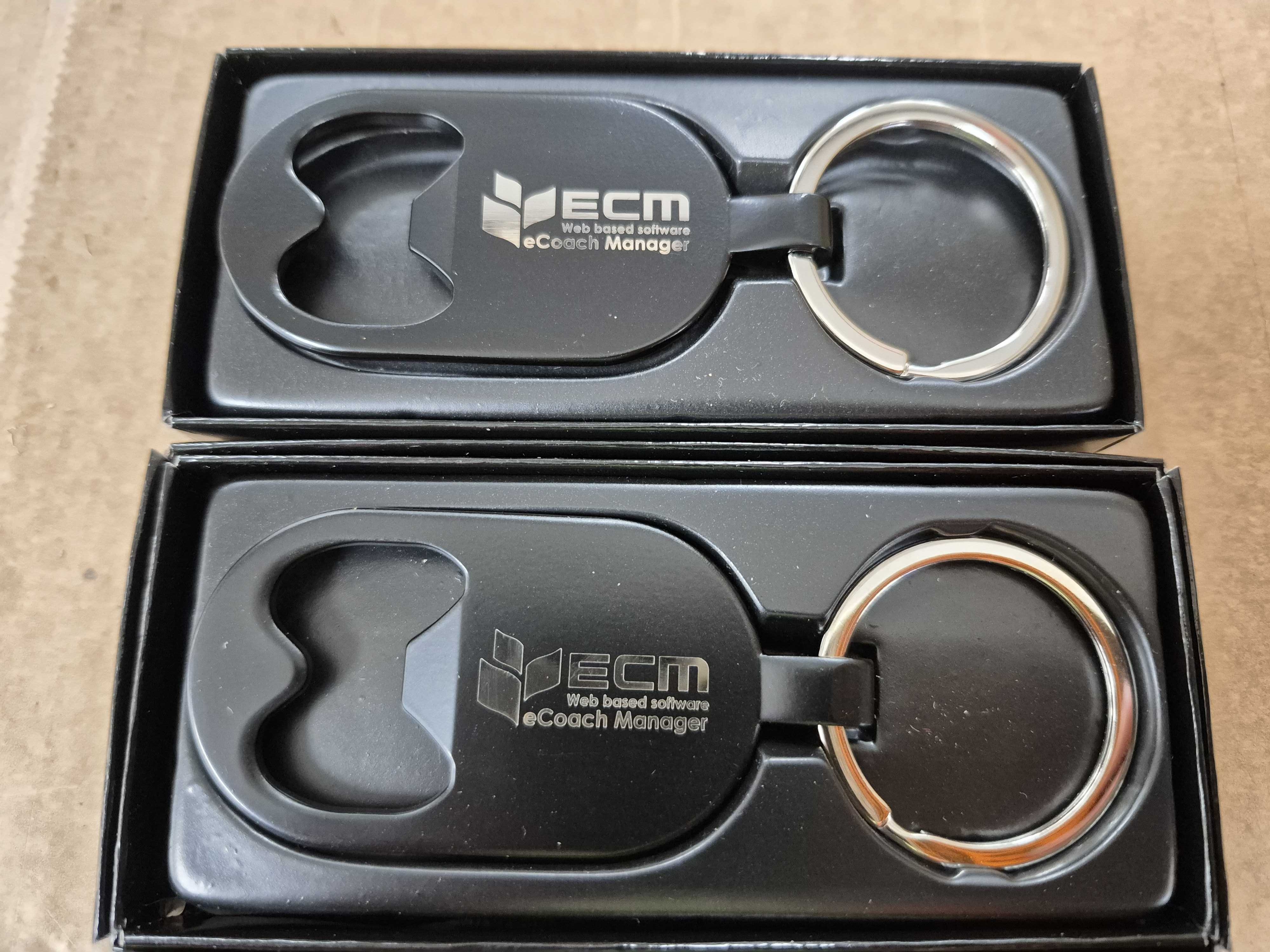 2 bottle opener keyrings in black boxes