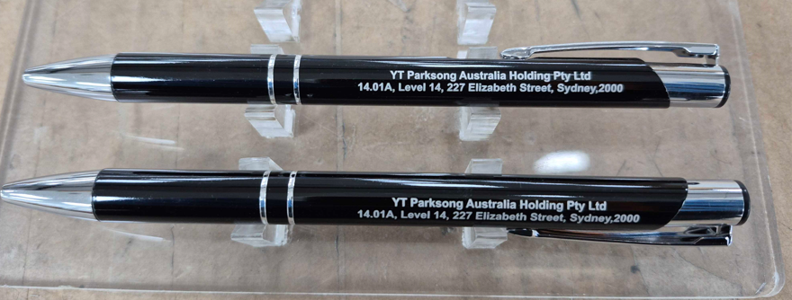 two black meta pens branded with logo and contact address