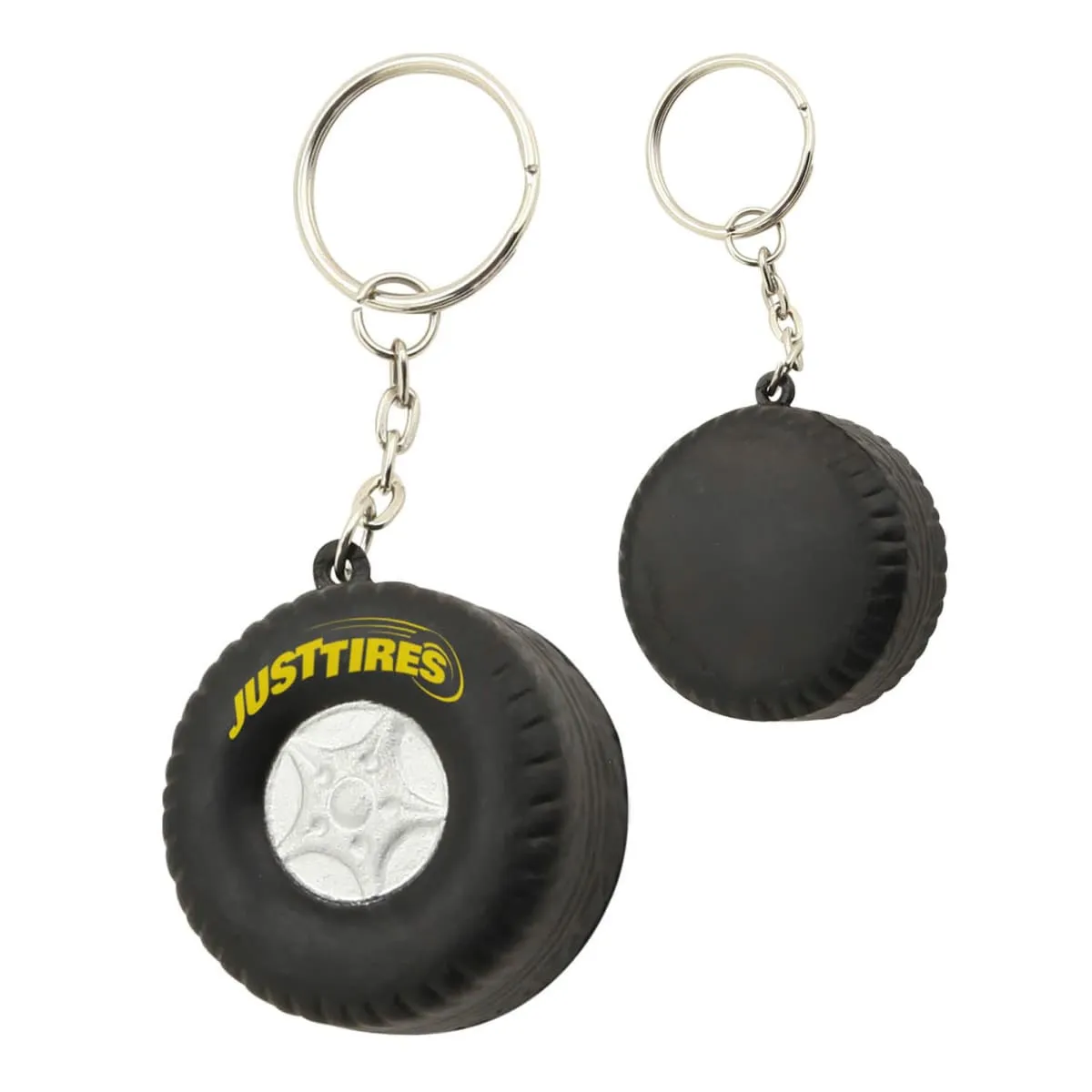 Two black tire-shaped keychains with JUSTTIRES written on one in yellow letters.||Two black tire-shaped keychains