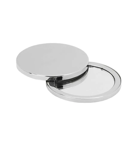 A round, silver compact mirror partially open on a white background.