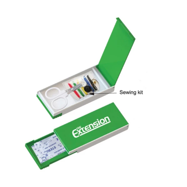 The Sew & Cut Kits box, a green rectangular container labeled Extension, is open. It reveals an assortment of items like scissors, colored threads, needles, and buttons inside. The lid is partially detached, showcasing the kits essential sewing tools.