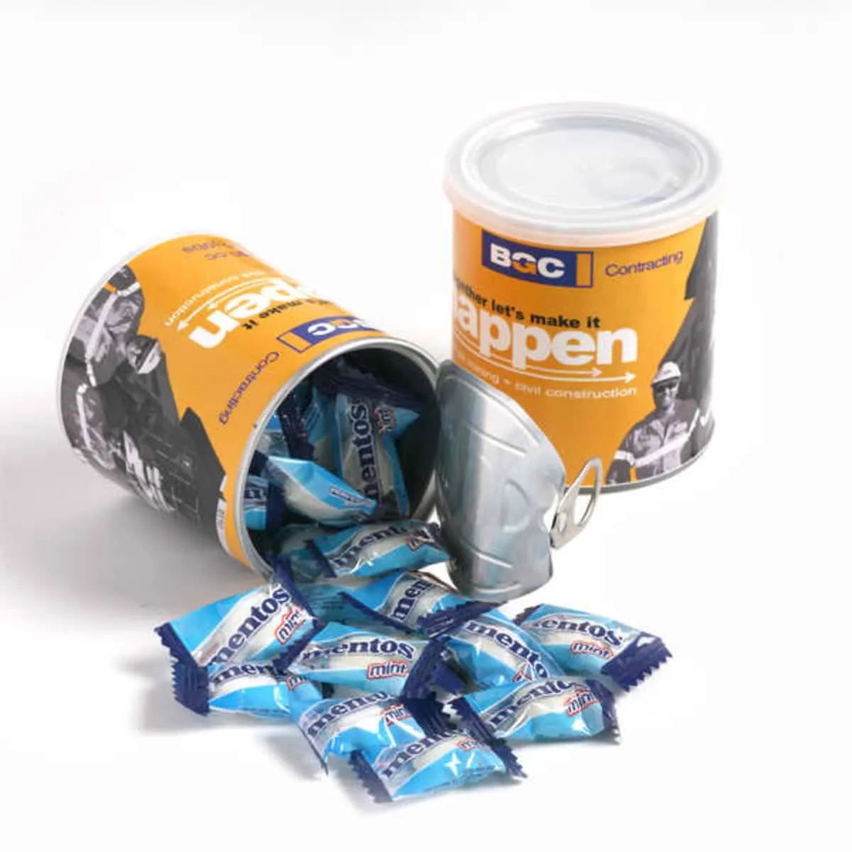 Two cans, one open, spilling blue Mentos candy packets and a small metal pail.