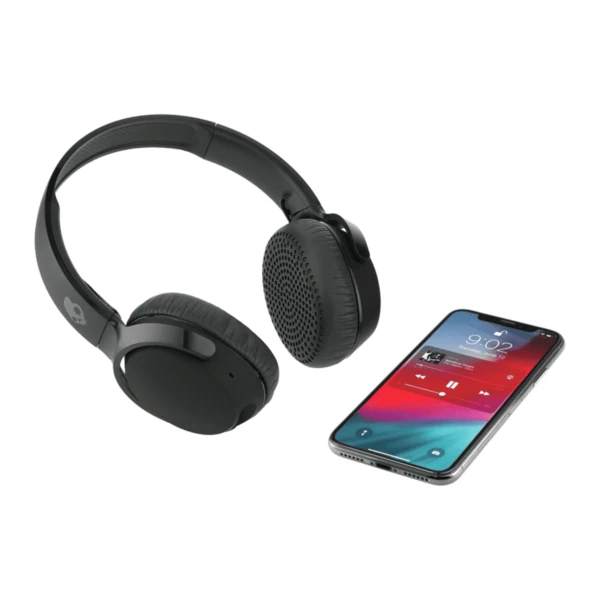 Black wireless headphones next to a smartphone playing music on a white background.