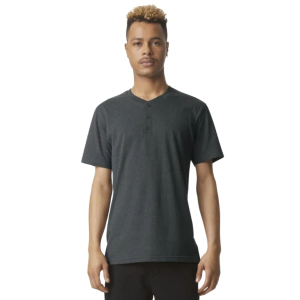 Adult wearing a black Gildan Softstyle Adult CVC T-Shirt against a white background.