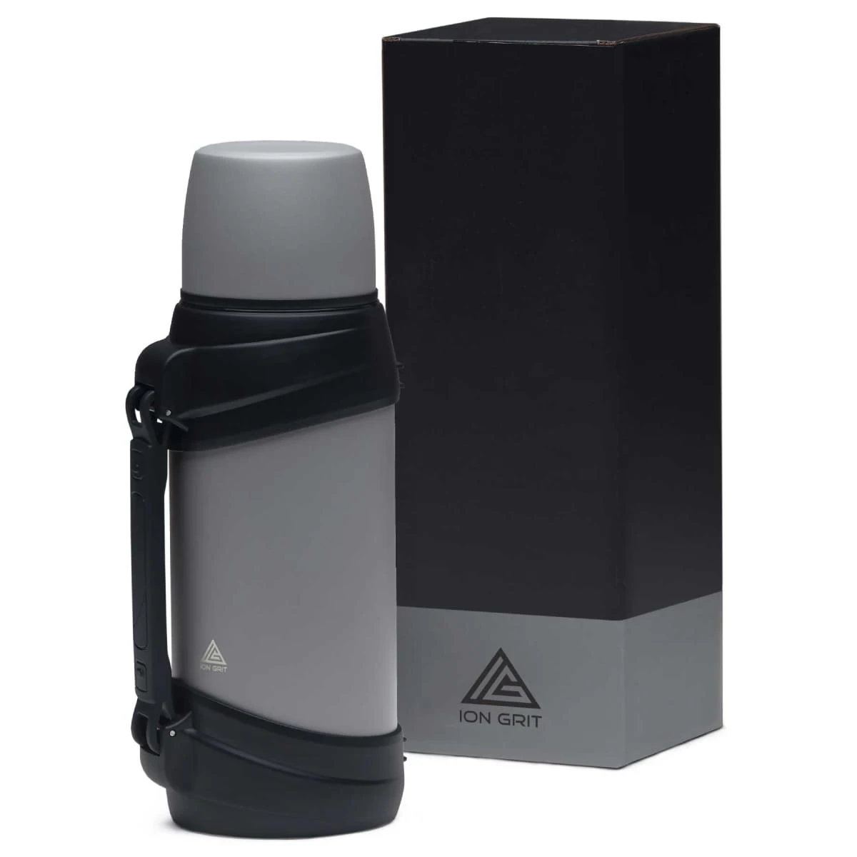 A gray thermos with a black handle next to its matching black and gray box.