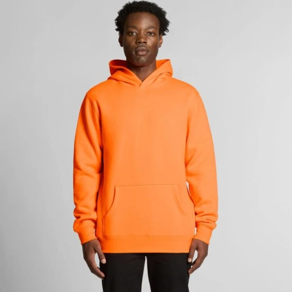 Person wearing a bright orange hoodie and black pants, standing against a plain background.