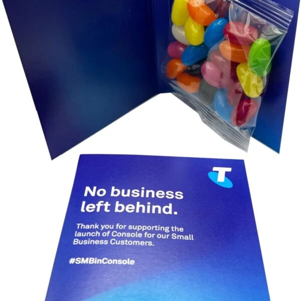Blue card with Telstra logo, message, and a packet of colorful jelly beans inside.