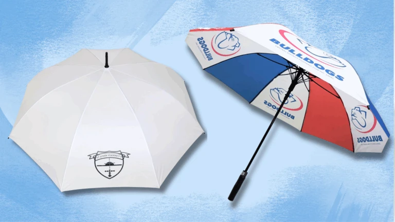 Two golf umbrellas: one plain white with a logo, one red, white, and blue with BULLDOGS text.