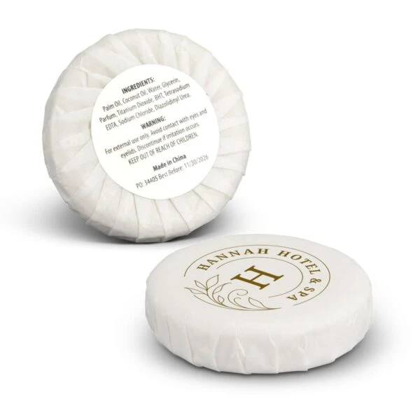 Two round, white wrapped hotel soaps labeled HANNAH HOTEL & SPA with ingredients visible.